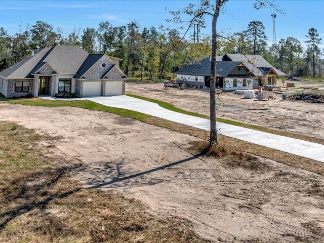 view of front of home with concrete driveway