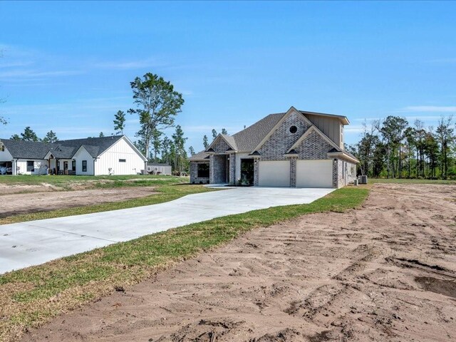 view of front facade with an attached garage and concrete driveway
