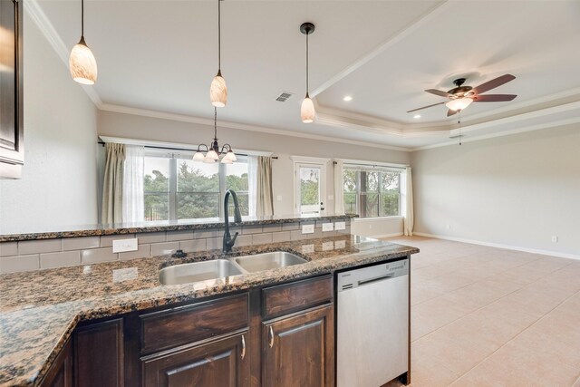 kitchen with stainless steel dishwasher, a sink, dark brown cabinetry, and visible vents