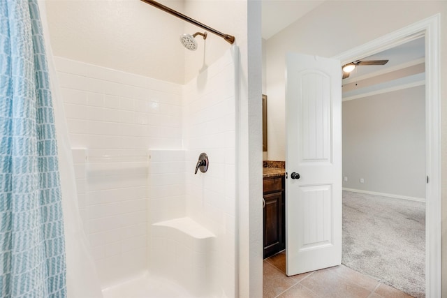 full bath with vanity, tile patterned flooring, and a stall shower