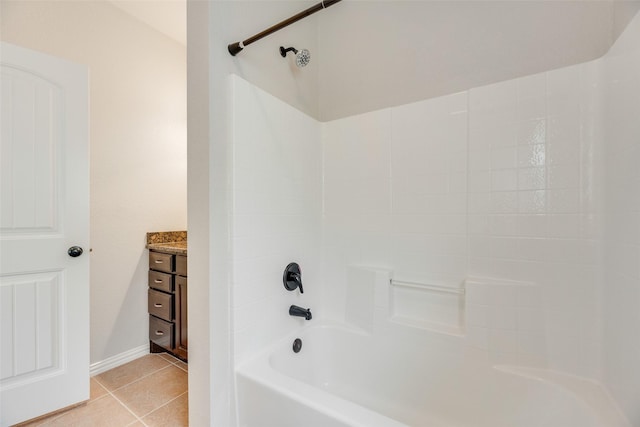 full bathroom featuring tile patterned floors, baseboards, vanity, and bathtub / shower combination