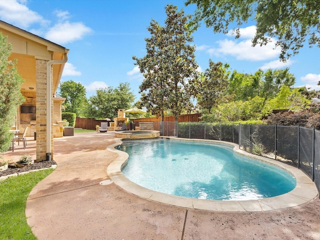 5522 Texas Trl, Colleyville, TX 76034 - view of pool featuring an outdoor stone fireplace, a patio, a fenced backyard, and a pool with connected hot tub