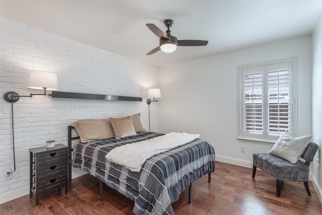 4045 Sun King Ln, Frisco, TX 75033 - bedroom featuring baseboards, a ceiling fan, brick wall, and wood finished floors