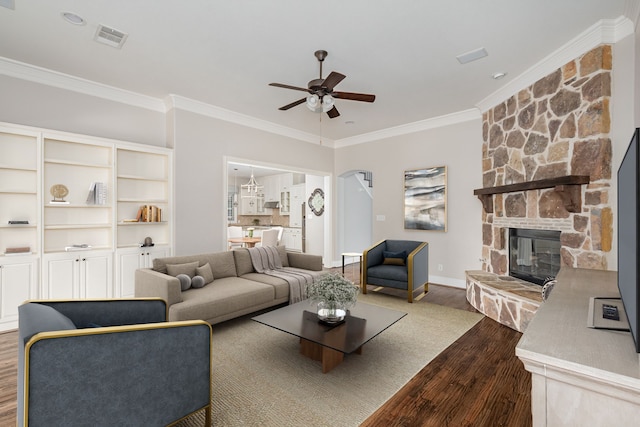 2231 Morning Dew Ct, Allen, TX 75013 - living room featuring dark wood finished floors, crown molding, ceiling fan, a fireplace, and baseboards