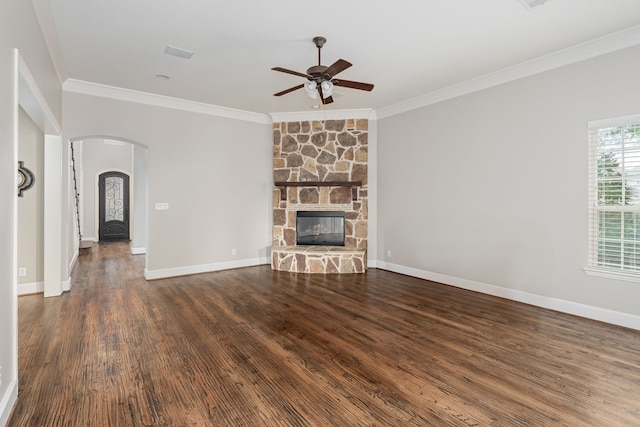 2231 Morning Dew Ct, Allen, TX 75013 - unfurnished living room with ceiling fan, crown molding, arched walkways, wood finished floors, and baseboards