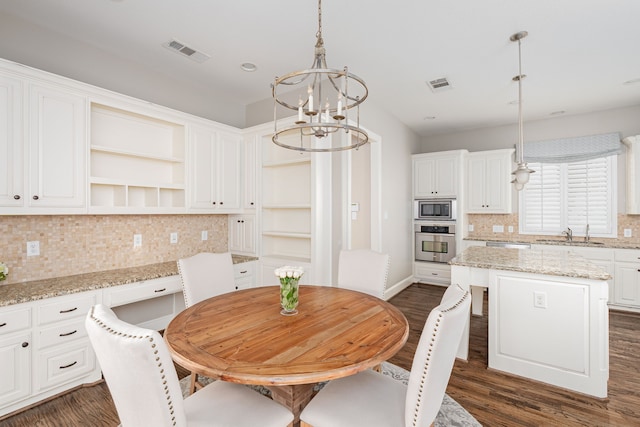 2231 Morning Dew Ct, Allen, TX 75013 - kitchen featuring stainless steel appliances, open shelves, a chandelier, tasteful backsplash, and white cabinets