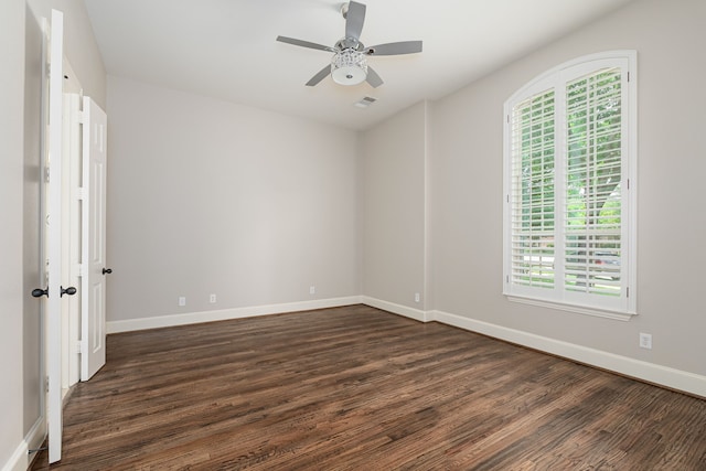2231 Morning Dew Ct, Allen, TX 75013 - unfurnished room with dark wood-style flooring, a ceiling fan, and baseboards