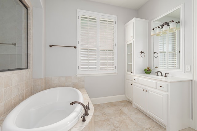 2231 Morning Dew Ct, Allen, TX 75013 - full bathroom with a garden tub, vanity, and baseboards