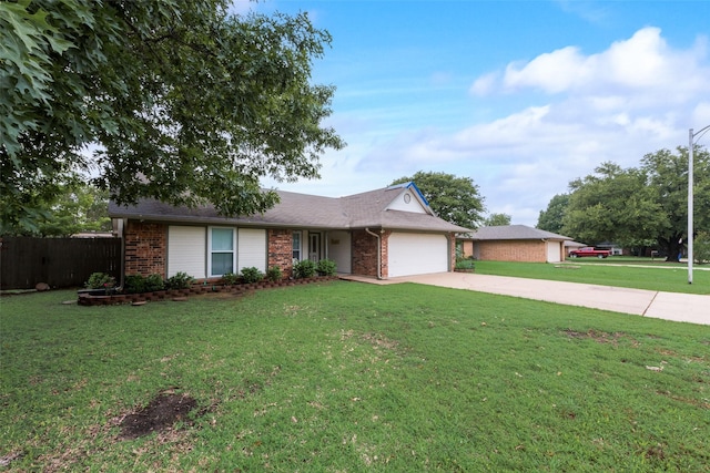 ranch-style home featuring brick siding, an attached garage, driveway, and a front lawn