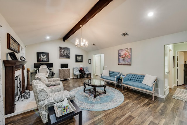 living area featuring visible vents, a high end fireplace, wood finished floors, and an inviting chandelier