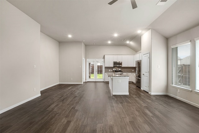 5608 Crestview Dr, Celina, TX 75009 - kitchen featuring a ceiling fan, appliances with stainless steel finishes, open floor plan, white cabinetry, and an island with sink