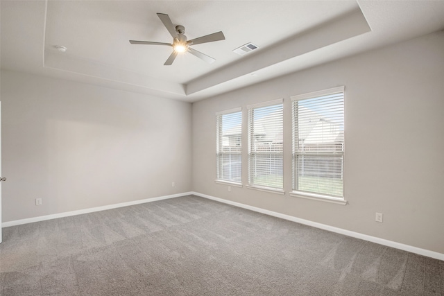 5608 Crestview Dr, Celina, TX 75009 - carpeted empty room with baseboards, ceiling fan, a tray ceiling, and visible vents