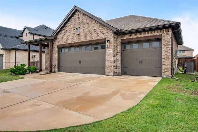 5608 Crestview Dr, Celina, TX 75009 - view of front of property with an attached garage, brick siding, a front yard, central air condition unit, and driveway