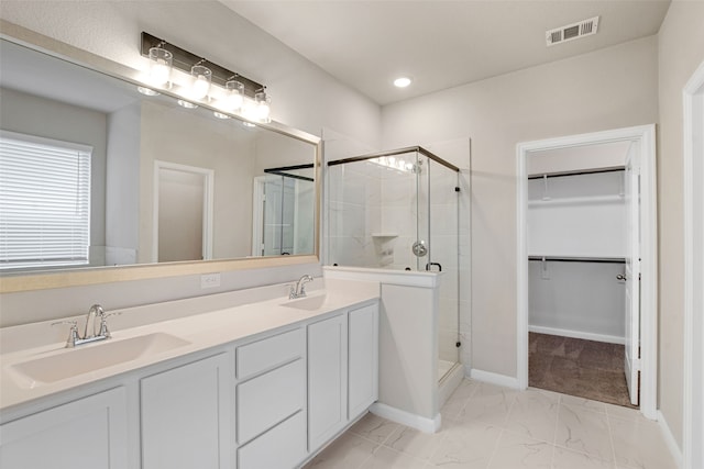 5608 Crestview Dr, Celina, TX 75009 - full bathroom with a walk in closet, visible vents, a shower stall, and a sink