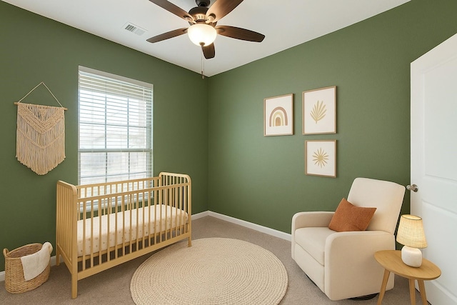 5608 Crestview Dr, Celina, TX 75009 - carpeted bedroom featuring baseboards, visible vents, a crib, and ceiling fan