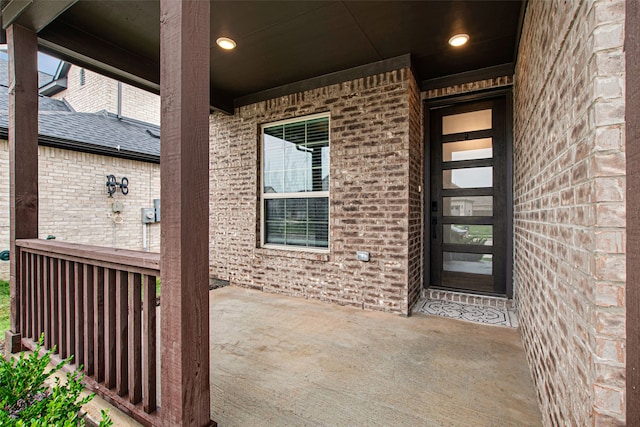 5608 Crestview Dr, Celina, TX 75009 - view of exterior entry with brick siding and a shingled roof