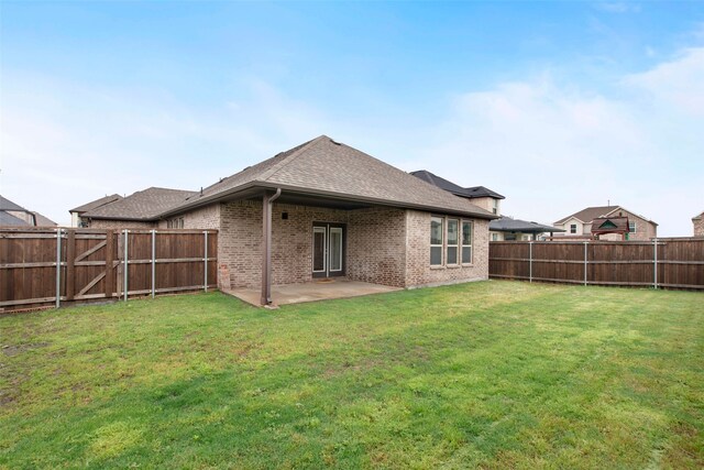 5608 Crestview Dr, Celina, TX 75009 - rear view of house featuring brick siding, a fenced backyard, a yard, a patio, and a shingled roof