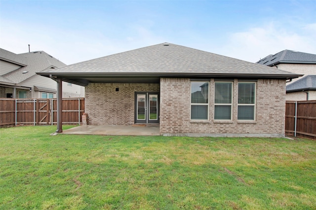 5608 Crestview Dr, Celina, TX 75009 - back of property with brick siding, a fenced backyard, a patio area, and a shingled roof