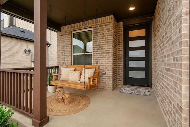 5608 Crestview Dr, Celina, TX 75009 - doorway to property featuring a porch and brick siding