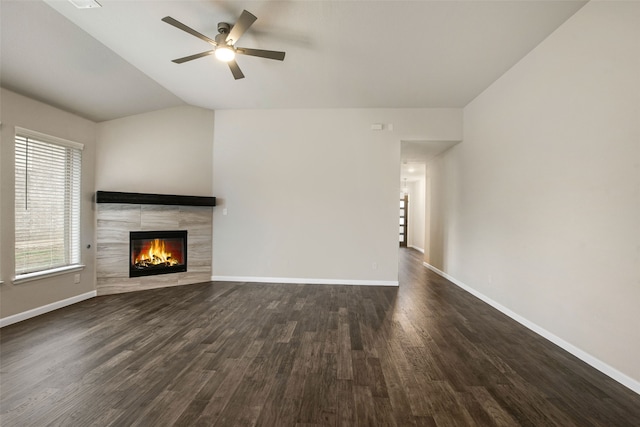 5608 Crestview Dr, Celina, TX 75009 - unfurnished living room featuring a ceiling fan, a fireplace, vaulted ceiling, dark wood finished floors, and baseboards