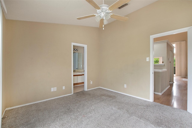 empty room featuring visible vents, a ceiling fan, carpet, and baseboards