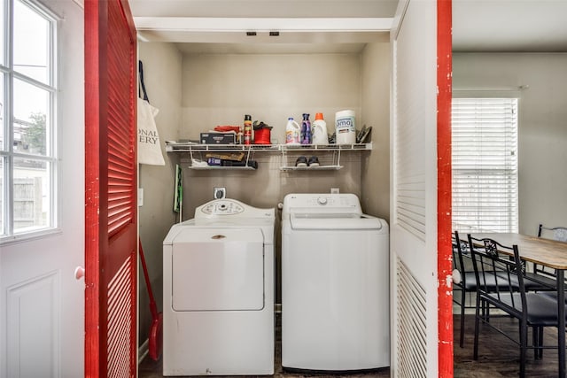 clothes washing area featuring laundry area and washer and clothes dryer