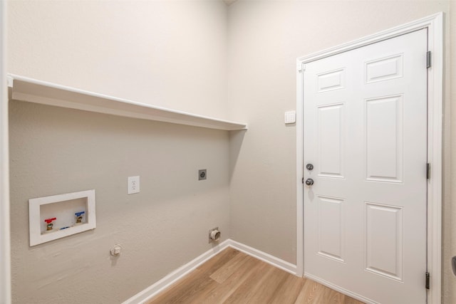 washroom with laundry area, baseboards, hookup for a washing machine, light wood-style floors, and hookup for an electric dryer
