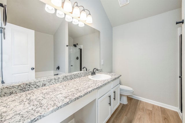 full bathroom with visible vents, an enclosed shower, wood finished floors, baseboards, and lofted ceiling