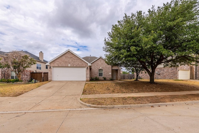 ranch-style house featuring concrete driveway, brick siding, fence, and a garage