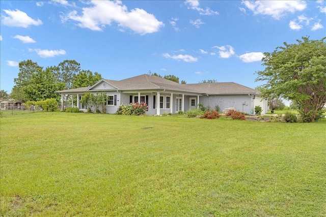 back of house with a yard and a porch
