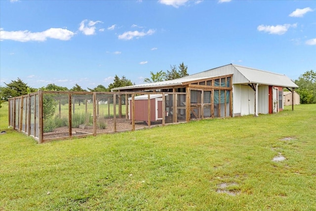 view of poultry coop with a lawn