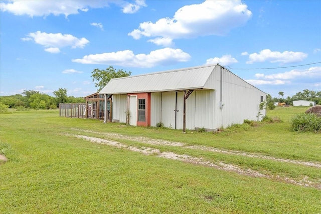 view of pole building with a lawn