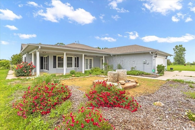 single story home featuring an attached garage and driveway