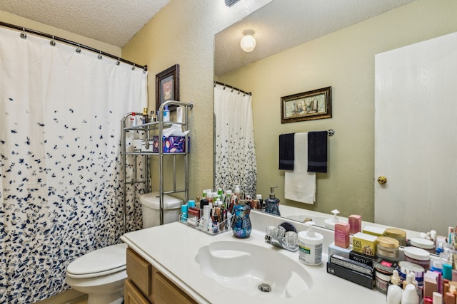 full bathroom with a shower with curtain, a textured ceiling, vanity, toilet, and a textured wall