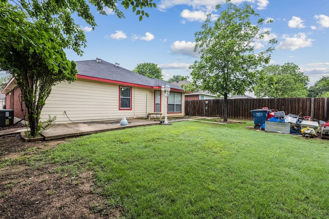 view of yard with a patio and fence