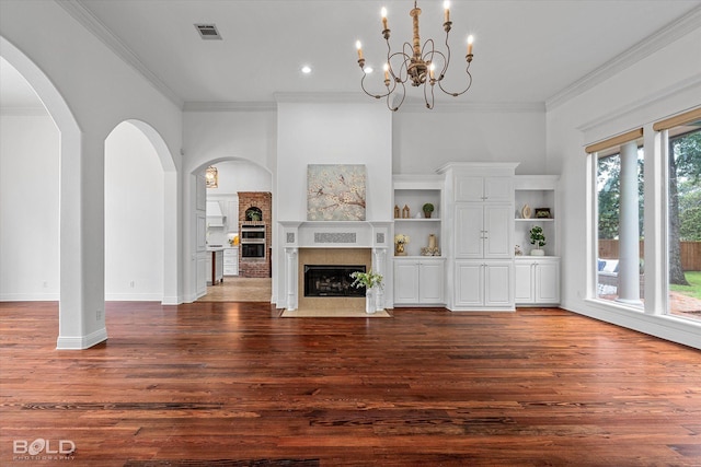 10535 Longfellow Trce, Shreveport, LA 71106 - unfurnished living room with a fireplace with flush hearth, ornamental molding, wood finished floors, a chandelier, and baseboards