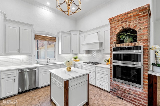 10535 Longfellow Trce, Shreveport, LA 71106 - kitchen featuring appliances with stainless steel finishes, a sink, crown molding, custom range hood, and decorative backsplash