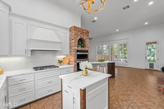 10535 Longfellow Trce, Shreveport, LA 71106 - kitchen featuring appliances with stainless steel finishes, premium range hood, ornamental molding, tasteful backsplash, and white cabinetry