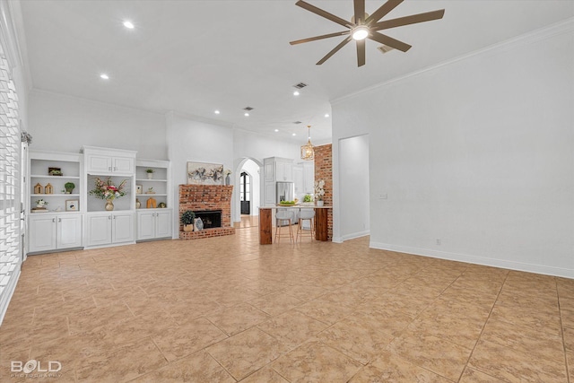 10535 Longfellow Trce, Shreveport, LA 71106 - unfurnished living room with ceiling fan, ornamental molding, a brick fireplace, and recessed lighting