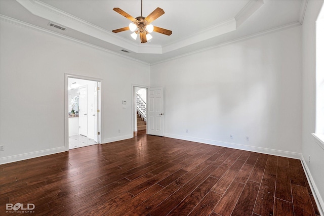 10535 Longfellow Trce, Shreveport, LA 71106 - unfurnished room featuring a raised ceiling, ceiling fan, wood finished floors, stairway, and crown molding