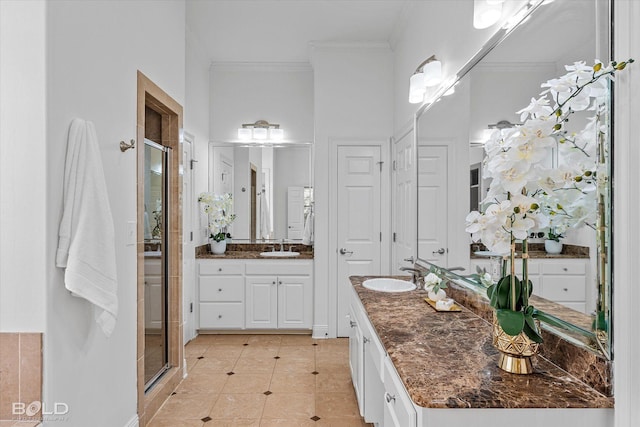 10535 Longfellow Trce, Shreveport, LA 71106 - bathroom featuring a shower stall, crown molding, two vanities, and tile patterned floors