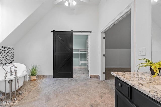 10535 Longfellow Trce, Shreveport, LA 71106 - additional living space with vaulted ceiling, ceiling fan, a barn door, and baseboards
