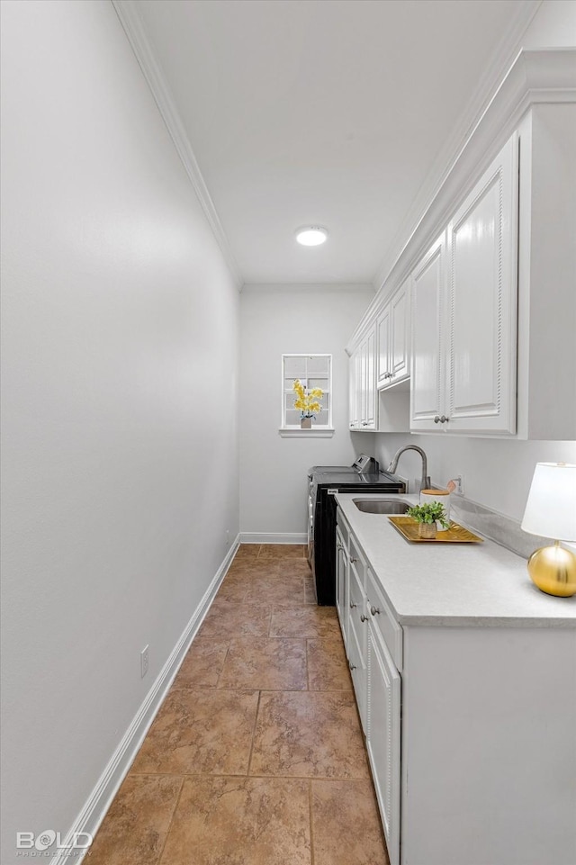 10535 Longfellow Trce, Shreveport, LA 71106 - kitchen with white cabinets, baseboards, washer and dryer, stone finish flooring, and light countertops