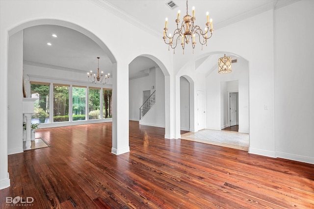 10535 Longfellow Trce, Shreveport, LA 71106 - unfurnished dining area featuring a chandelier, hardwood / wood-style flooring, crown molding, baseboards, and stairway