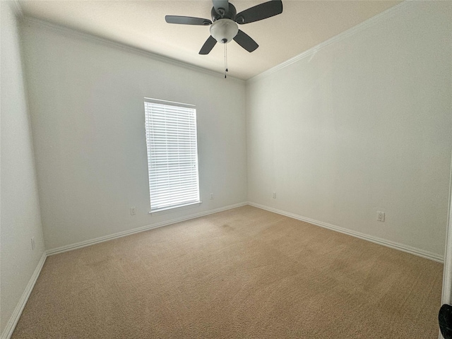 unfurnished room with a ceiling fan, baseboards, light carpet, and ornamental molding