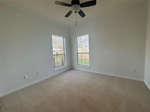 empty room with baseboards, a ceiling fan, and light carpet