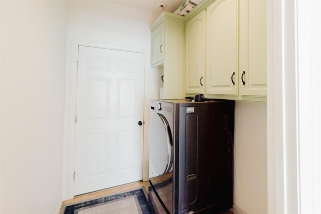 1503 S College Ave, Decatur, TX 76234 - laundry area with cabinet space and washer / dryer