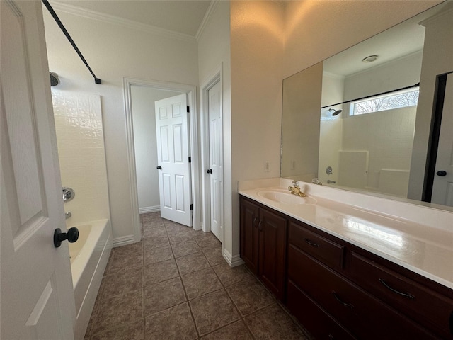 bathroom with crown molding, baseboards, vanity, tile patterned floors, and bathing tub / shower combination