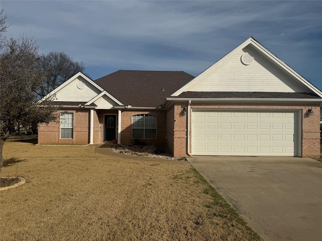 ranch-style house featuring an attached garage, a front yard, driveway, and brick siding