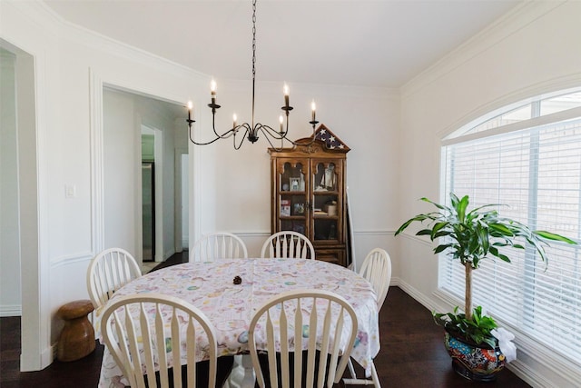 1503 S College Ave, Decatur, TX 76234 - dining area with wood finished floors, a chandelier, crown molding, and baseboards